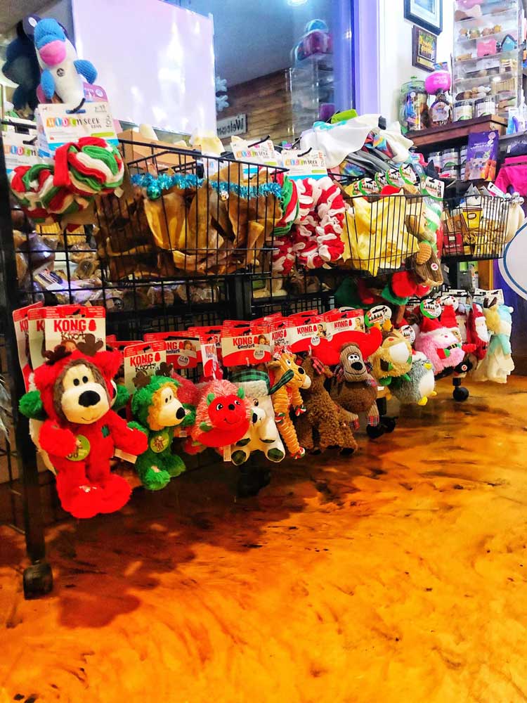 Rack of small Christmas dog toy stuffies